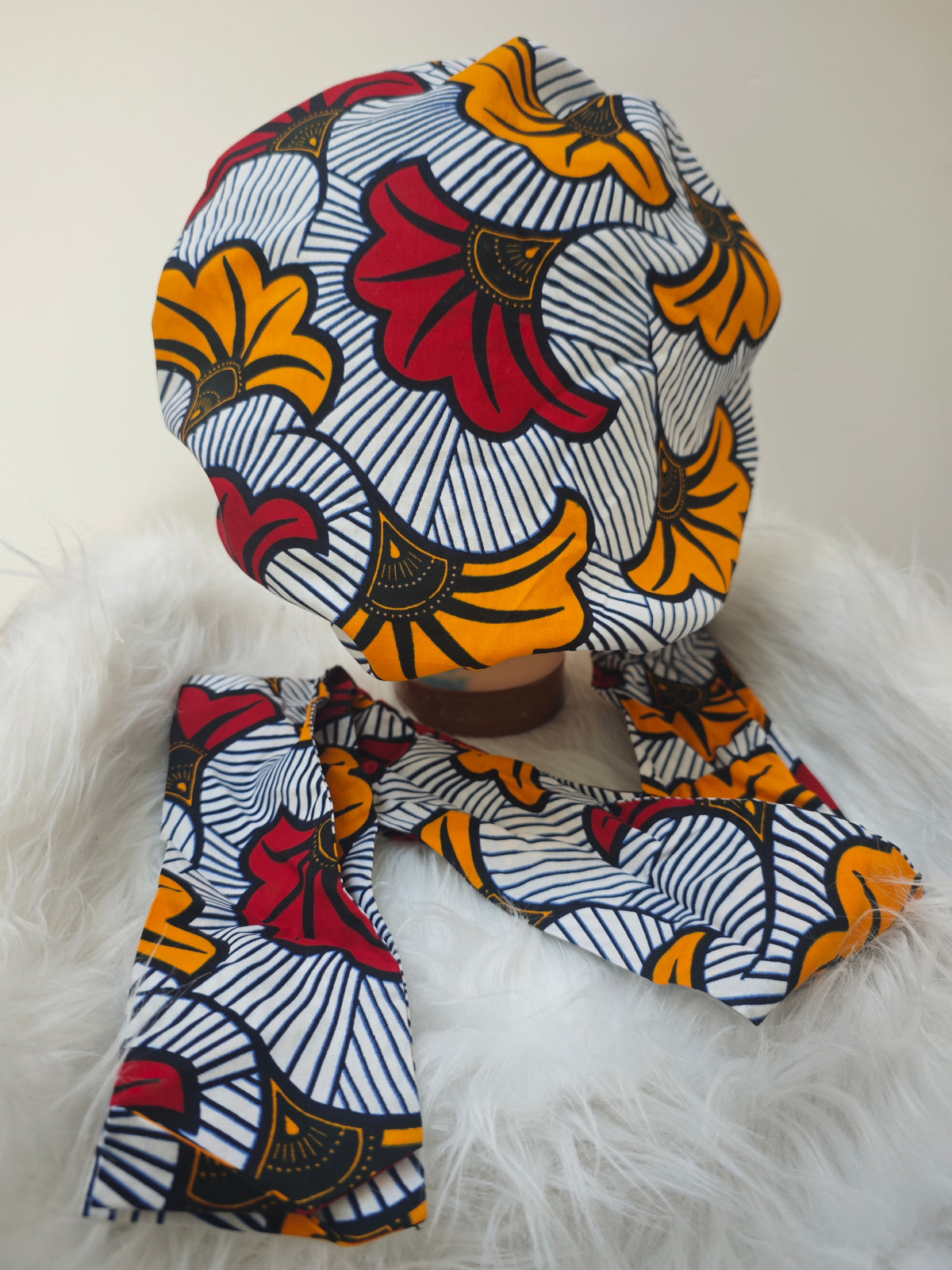 Muts met waxprint - Happy